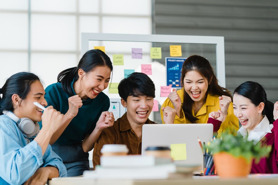A group of young asian employees in the workplace