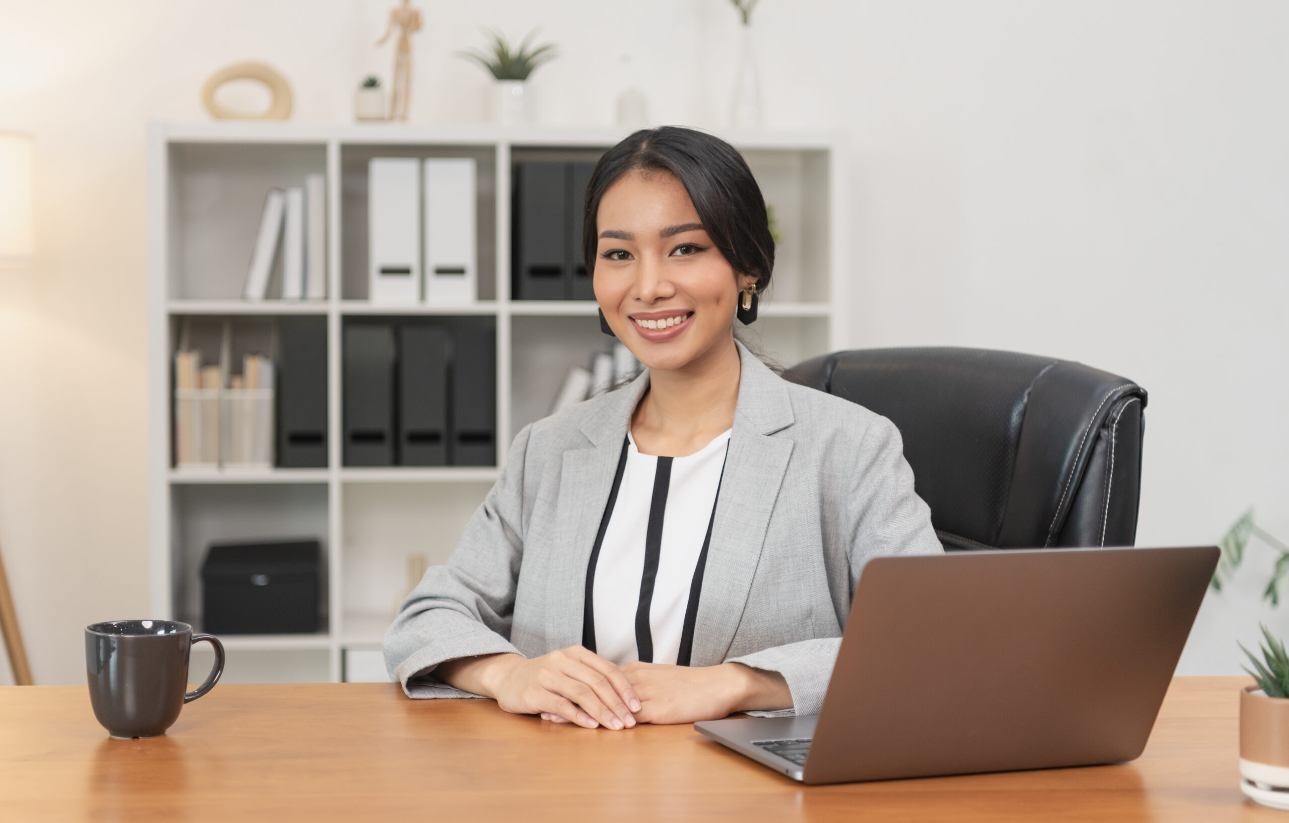 asian businesswoman sitting in office. Portrait executive woman.