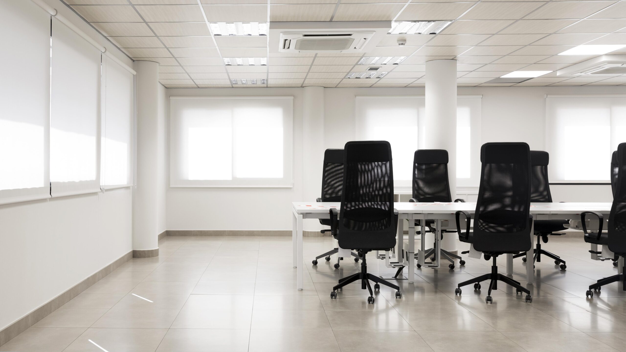 Empty office conference room with mesh chairs