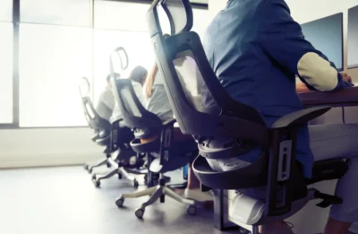mesh office chairs, People sitting on mesh office chairs doing some work
