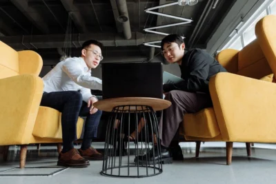 Ergonomic office chairs, Two business men collaborating in the lounge