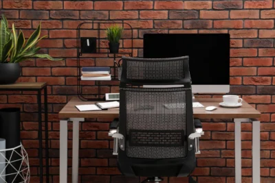 Mesh Chair Singapore with modern office table setup.